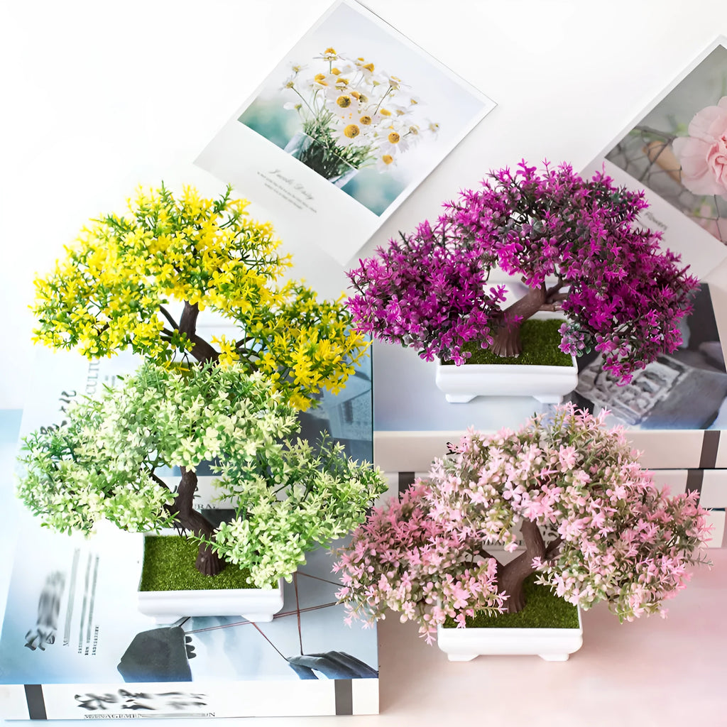 Artificial plastic flower bouquet in bonsai potted plant style with pink and white blooms