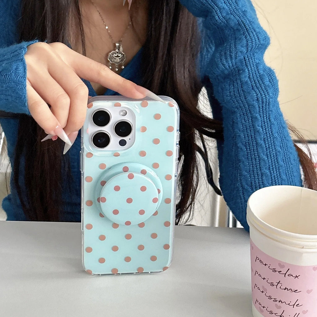 Polka dot phone case with magnetic bracket for iPhone in black showing kickstand