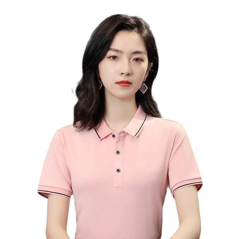 Beautician wearing a short-sleeved asymmetric polo shirt in light blue, showcasing the collar and Cool Silk Cotton fabric.