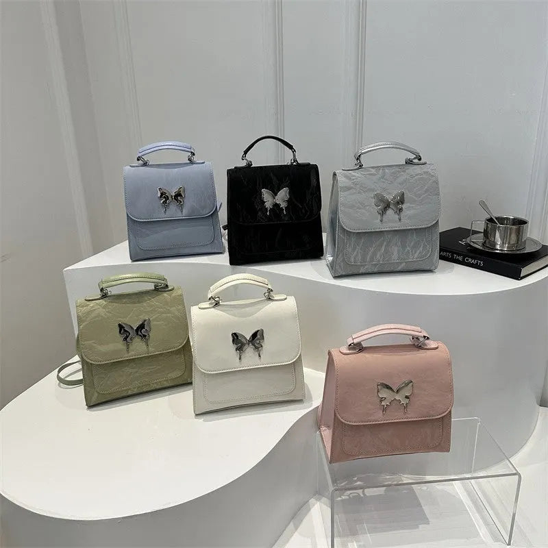Women's preppy style PU hand-carry backpack with bow detail in light blue colour