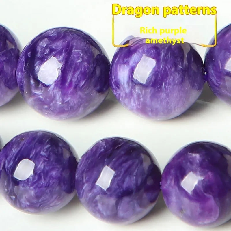 Natural transparent charoite hands design bead bracelet with platinum setting on a wrist.