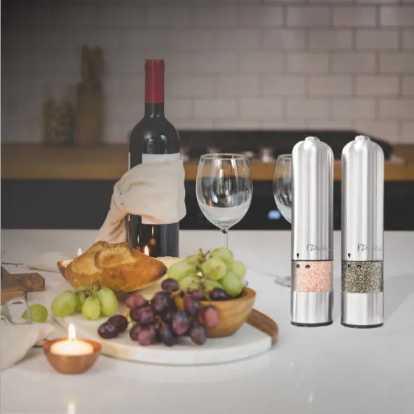 Stainless steel electric pepper grinder on a kitchen countertop