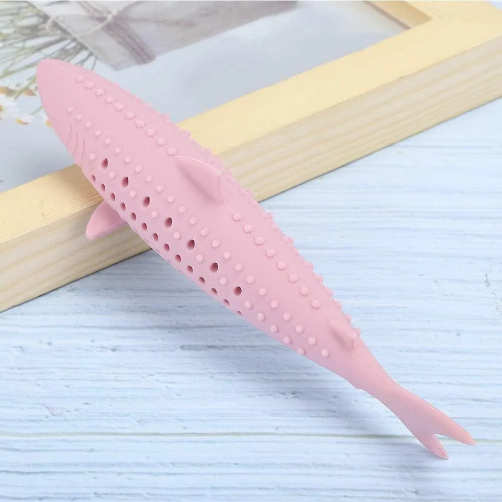Green silicone fish-shaped cat chew toy with side holes on a white background