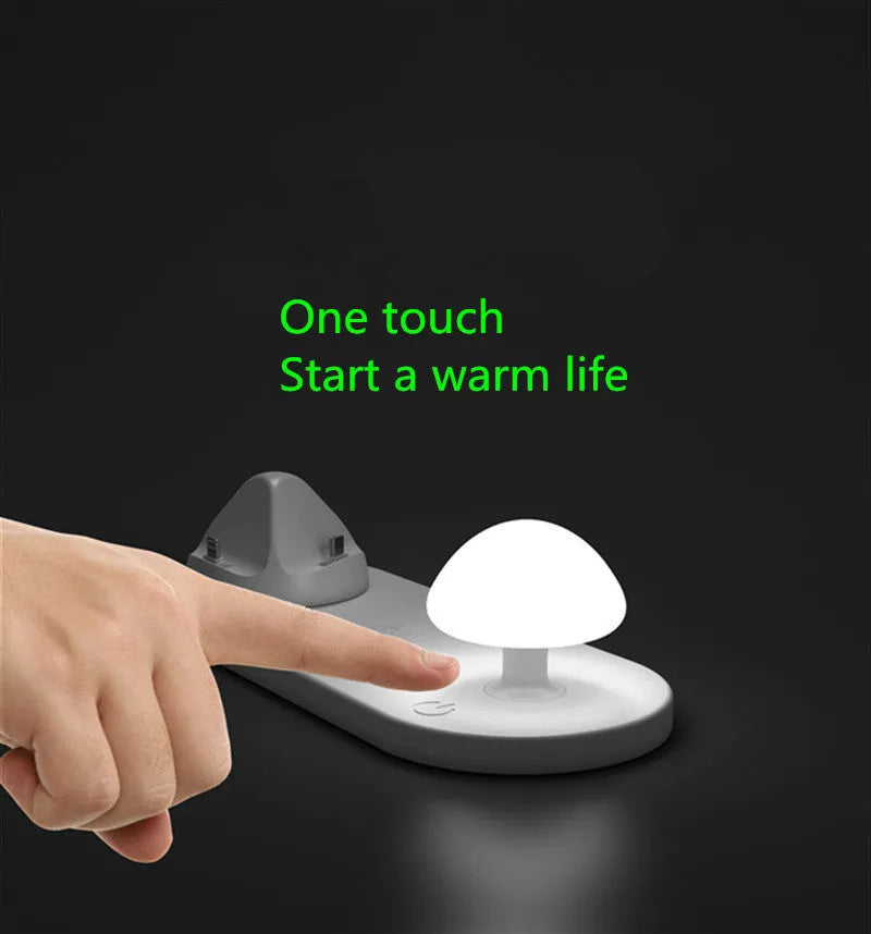 White 3 in 1 wireless charging dock with a phone on the pad and USB cable