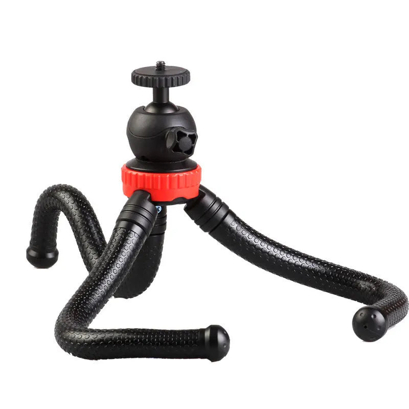 Black octopus tripod with spherical gimbal head wrapped around pole supporting mobile phone