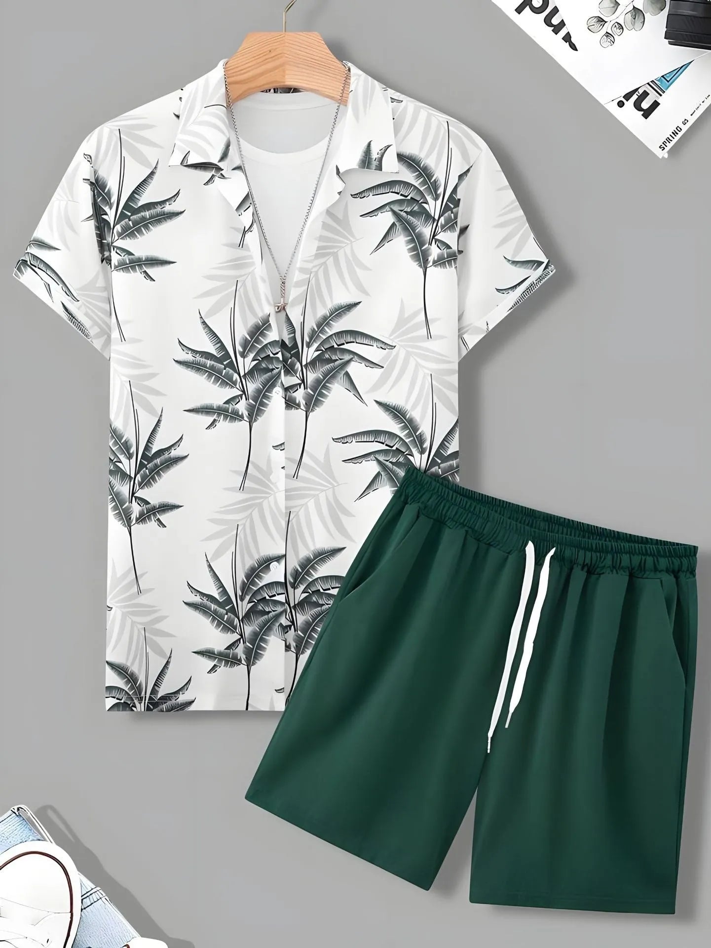 Black and white striped Hawaiian men's pullover shirt and shorts set on a model, loose fit, short sleeves.