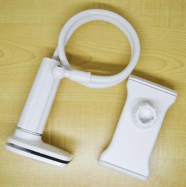 Bedside long-arm mobile phone holder in aluminium alloy and plastic on a table.