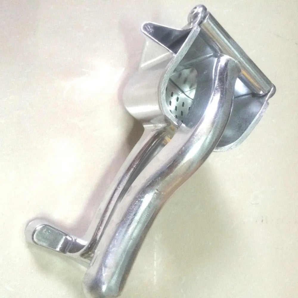 Silver heavy duty aluminium lemon squeezer with large bowl and steel lever on a kitchen counter.