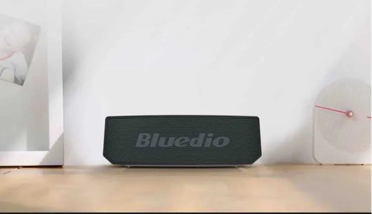 Black BS-6 cloud smart speaker showing compact design with Bluetooth connectivity.