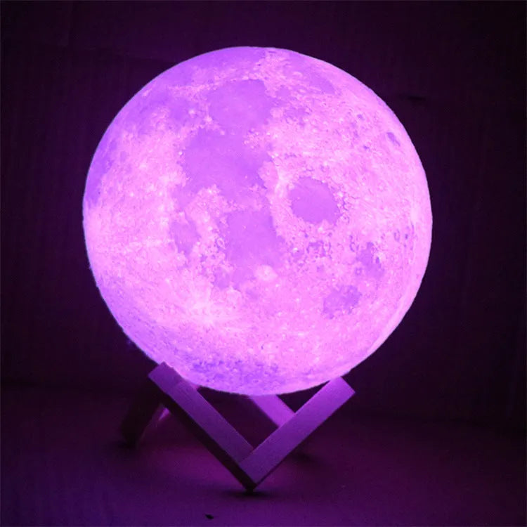 3D printed spherical moon lamp showing lunar surface texture on wooden holder