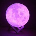 3D printed spherical moon lamp showing lunar surface texture on wooden holder