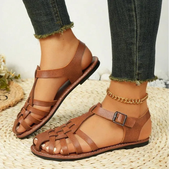 Dark brown women's vintage weave roman sandals with closed toe and buckle fastening on a soft rubber sole.