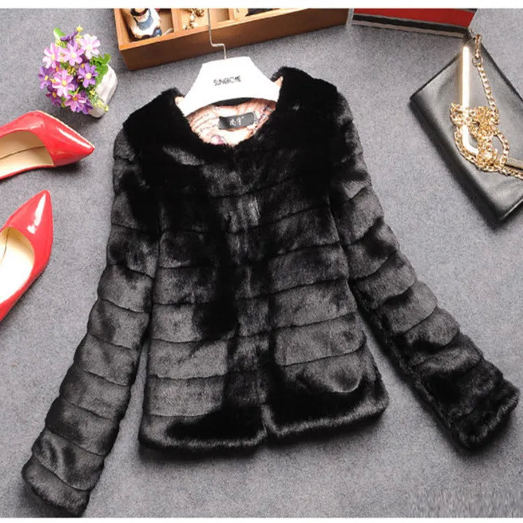 Women's short-length faux fur top in beige, black, or white with regular sleeves.