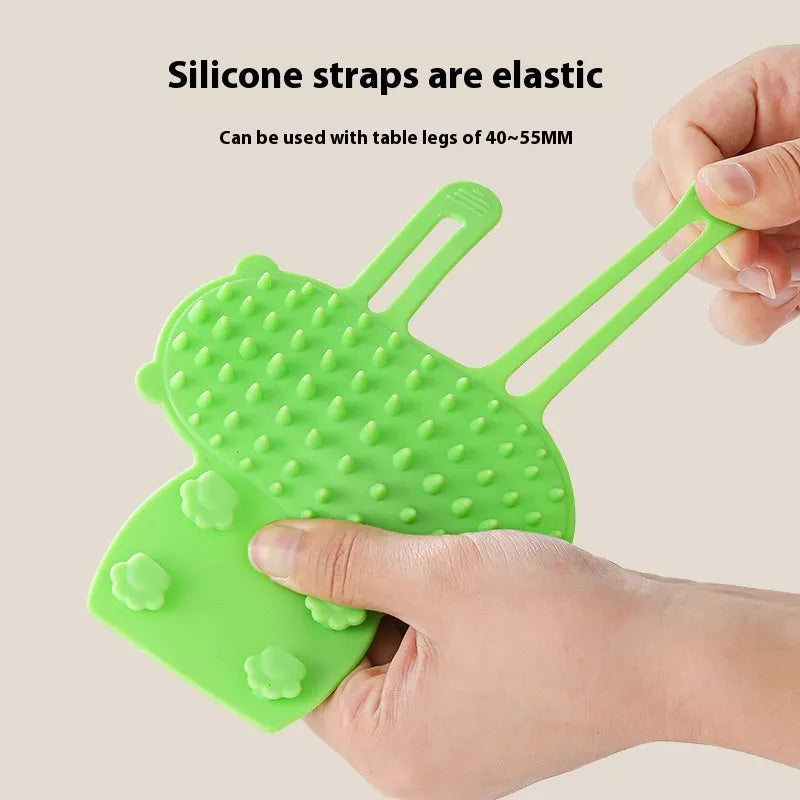 Adjustable silicone cat scratching comb mounted on a table leg in green colour.