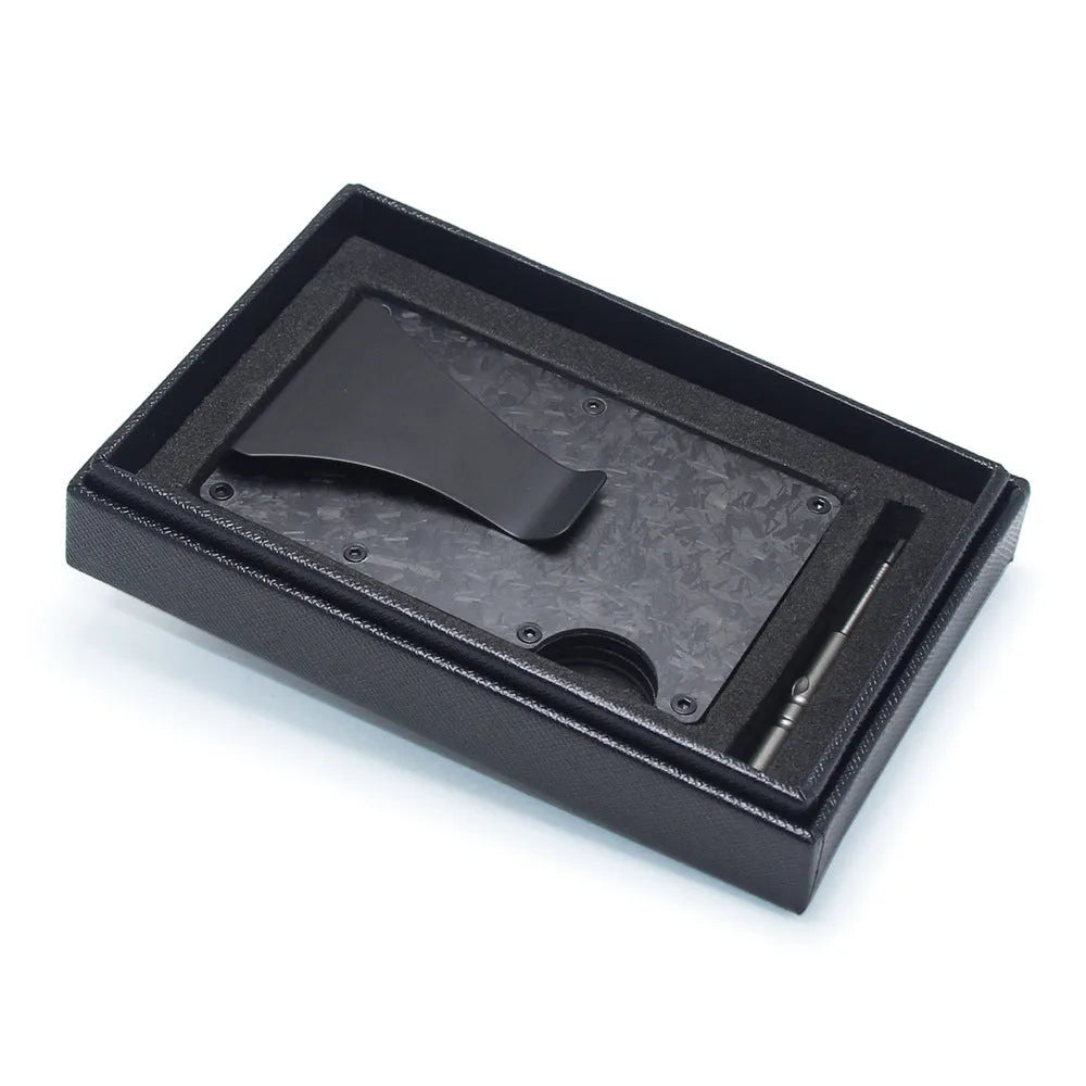 Slim black carbon fibre card holder wallet with geometric design on a gift box.
