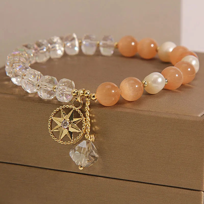 Gold-plated bracelet with eight Awn star motif and orange opal crystals
