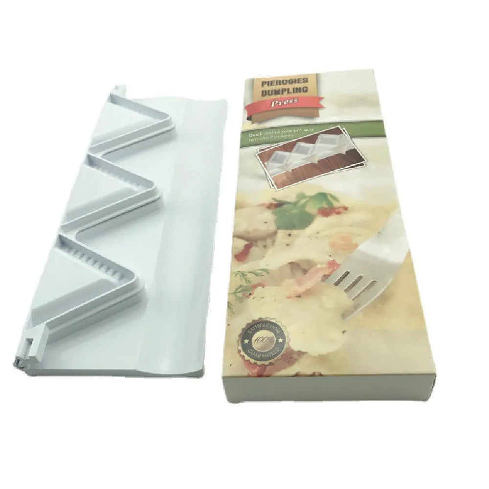 Pure white plastic dumpling maker 28.5 cm long on a kitchen countertop