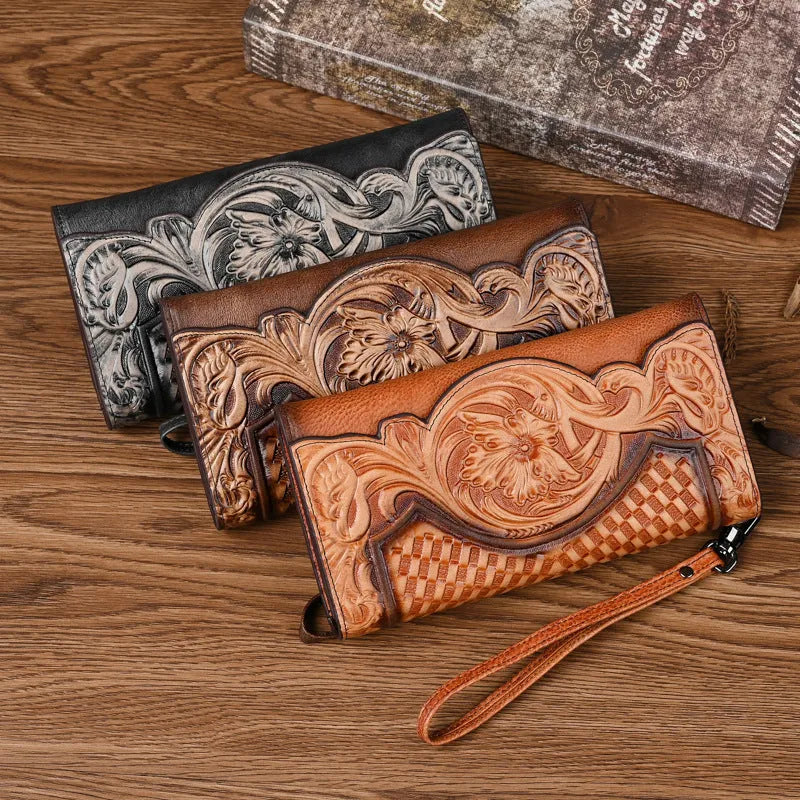 Retro brown embossed floral pattern tri-fold women's wallet made from genuine cowhide, shown open.