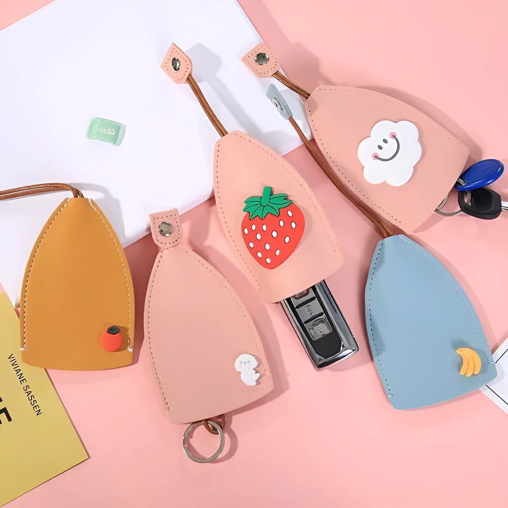 Cartoon pull-out key case in PU leather measuring 14 x 7.5 cm with colourful designs