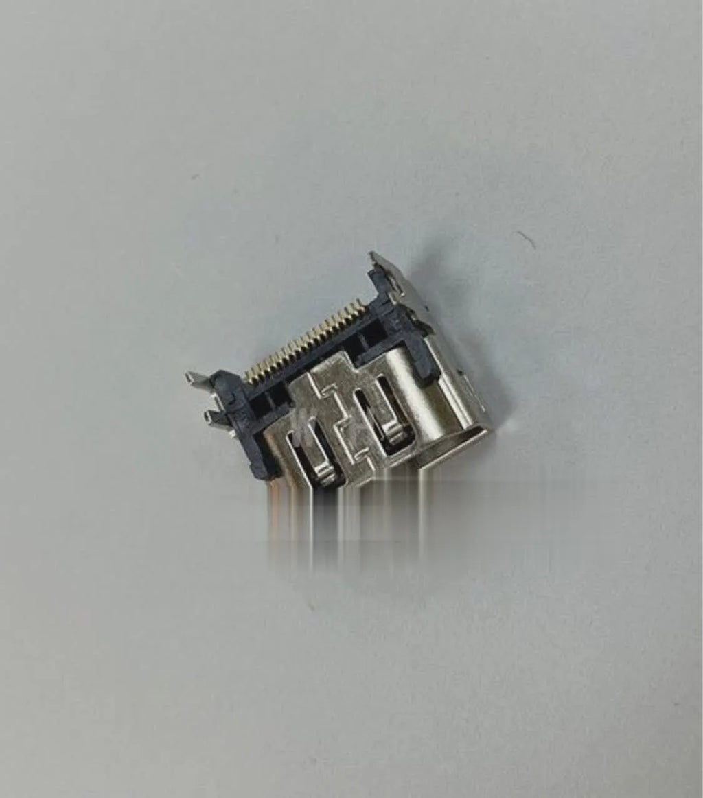 Silver HDMI host interface socket for game console repair and signal connectivity.