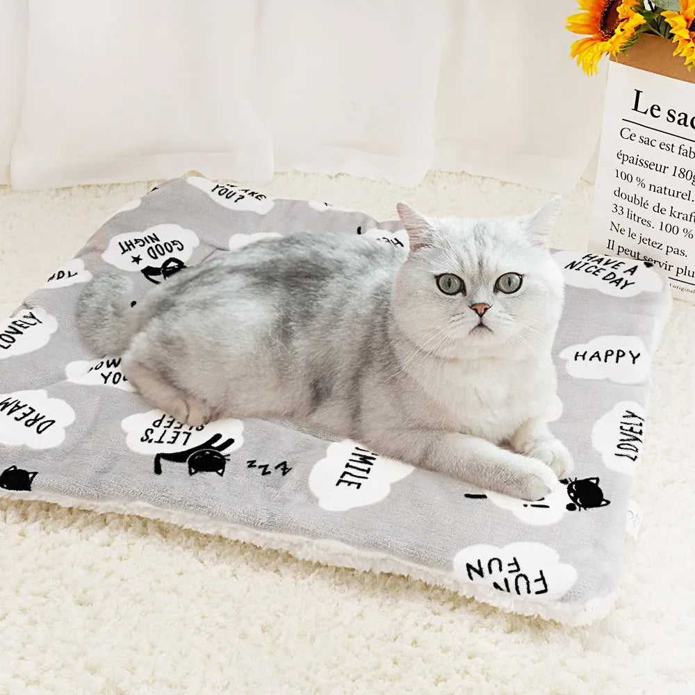 Lambskin pet blanket in flannel cashmere with cute cartoon pattern, grey colour, 55x70cm size on a pet bed