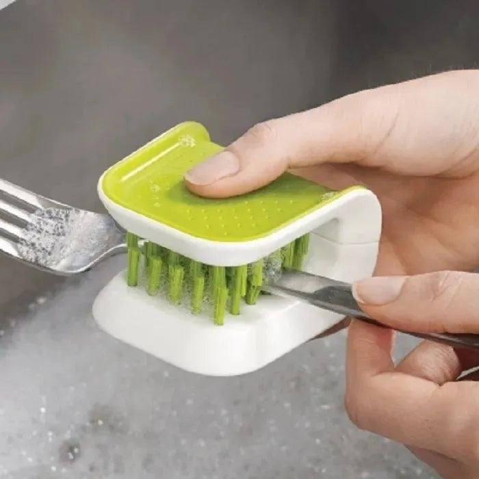 Blue U-shaped plastic brush for cleaning kitchen knives and forks.