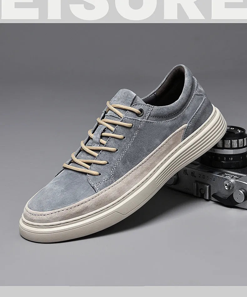 Men's grey casual leather skate shoes with a round toe and front lace-up on a soft rubber sole.