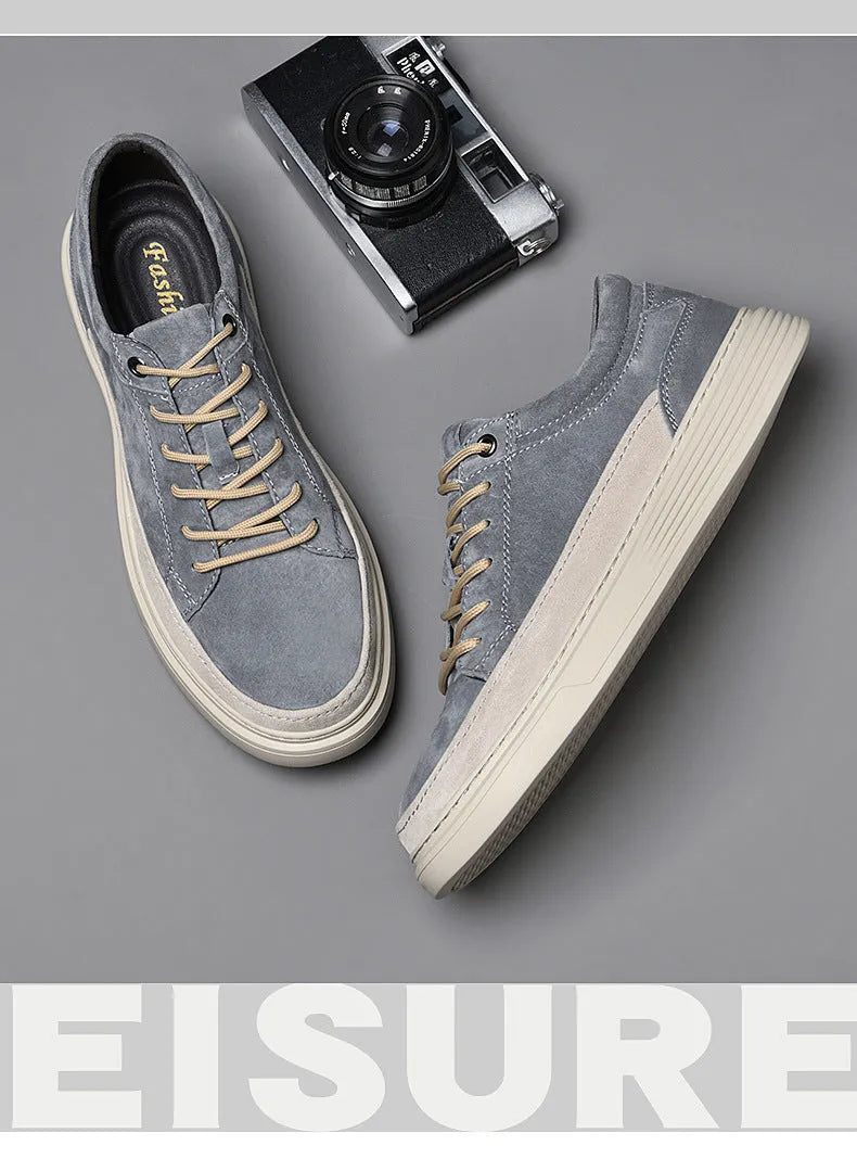 Men's grey casual leather skate shoes with a round toe and front lace-up on a soft rubber sole.