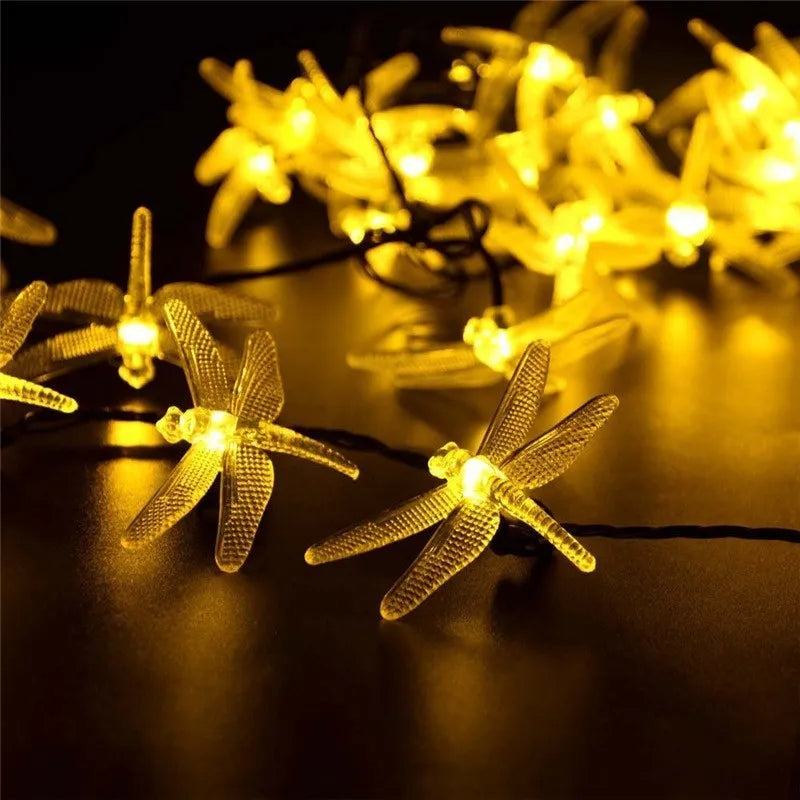 5m solar LED string lights with 30 warm white bulbs and ground-spike solar panel for outdoor garden use