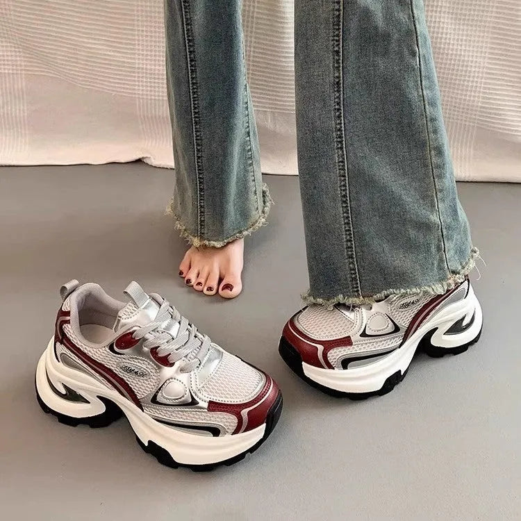 Women's silver and red mesh breathable platform sneakers with round toe and flat rubber sole.