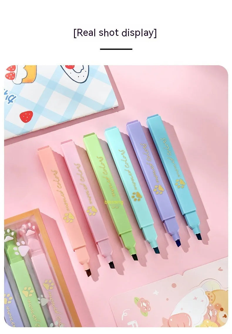 Cat's Paw set of six fluorescent marking pens with oblique heads in assorted colours.