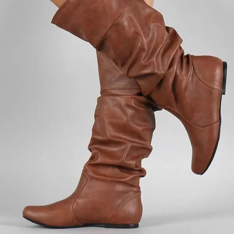 Women's flat slip-on ankle boots in artificial PU with a round toe and high cylinder design