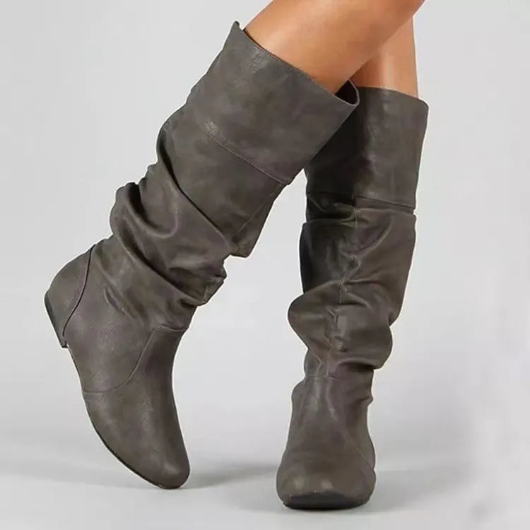 Women's flat slip-on ankle boots in artificial PU with a round toe and high cylinder design
