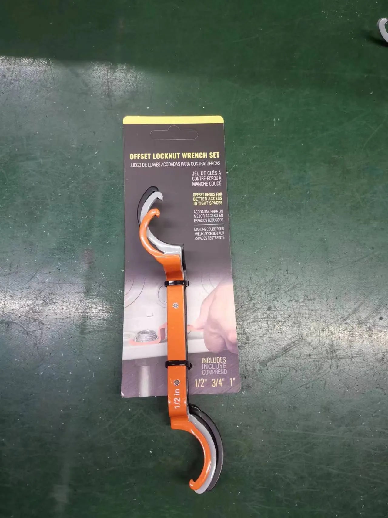 Orange, grey, and black magnetic suction wrenches laid out to show crescent, catheter locking, and standard spanner types.