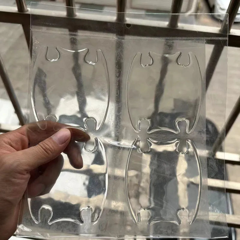 Four transparent 3D protective stickers for car interior door handle bowls.