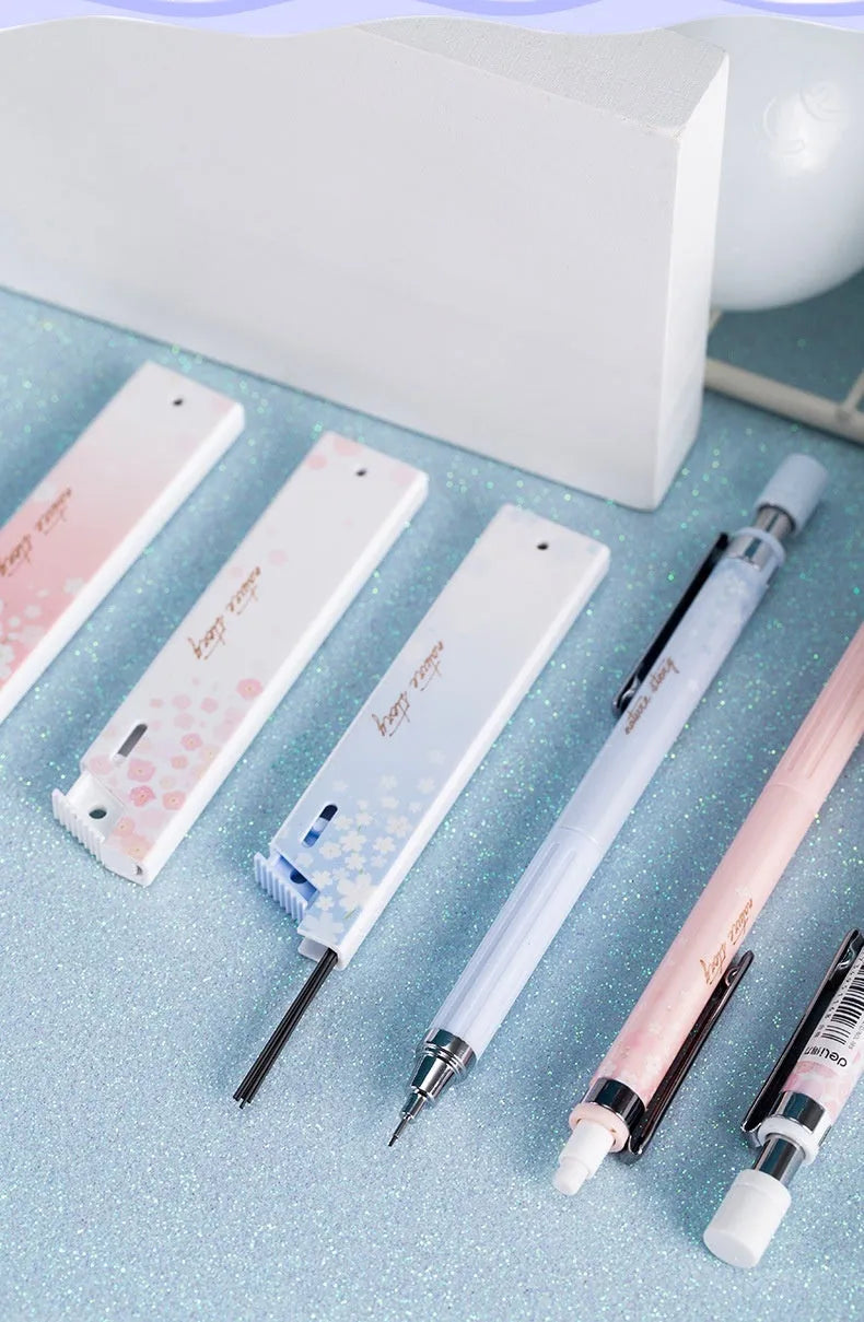 Mixed colour Sakura law pattern 0.5mm automatic pencil set with three pencils and three refill boxes.