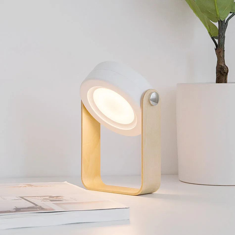 Foldable touch dimmable LED night light in white, shown in both table lamp and unfolded lantern modes.