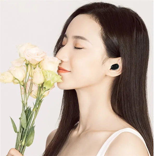 M1 Bluetooth wireless earbuds in black and white colours showing bilateral stereo design