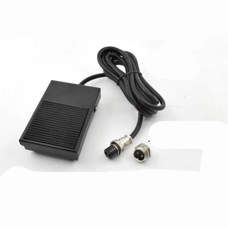 Metal welding machine foot switch with rubber pedals and a long black cable.