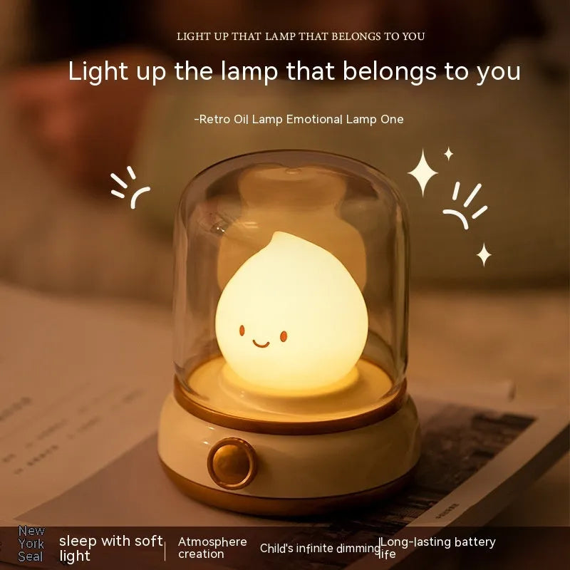 Green retro-style USB rechargeable LED night lamp with dimmer knob on wooden table