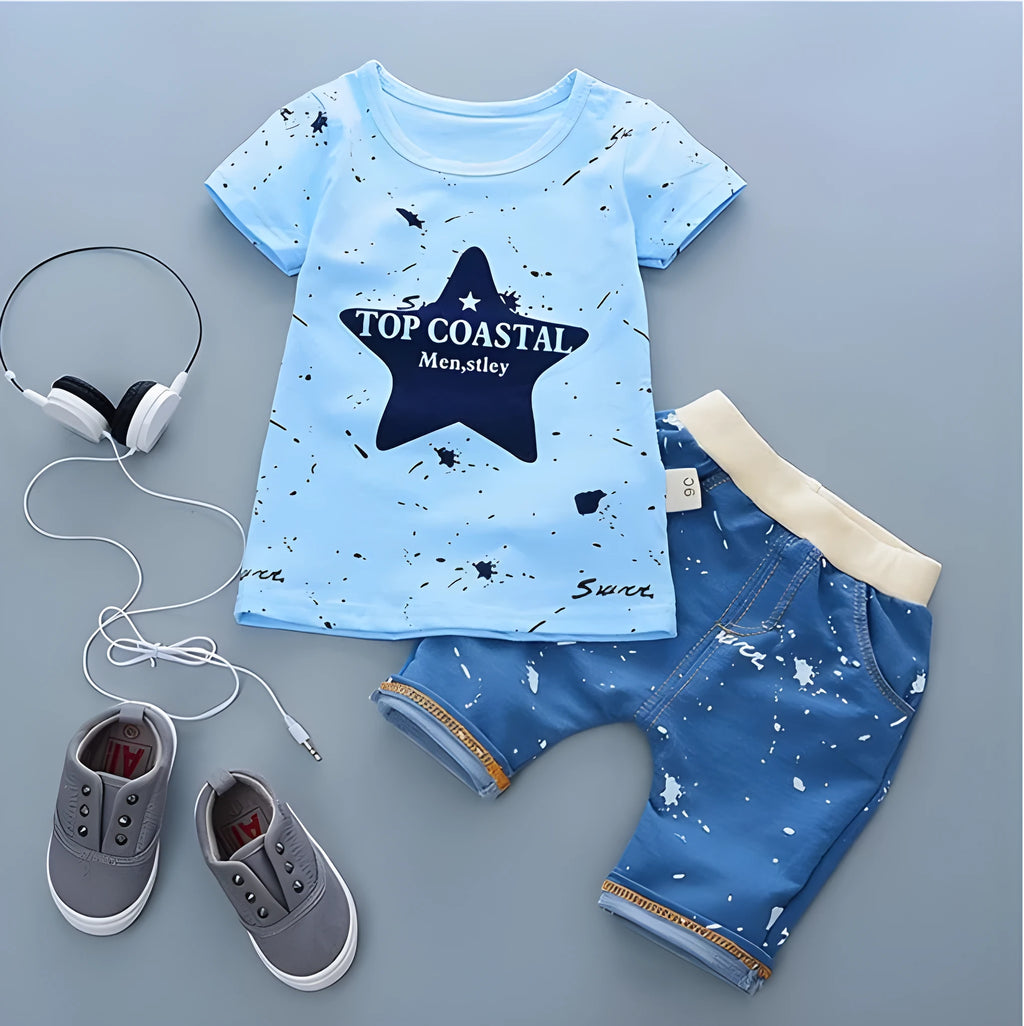 Baby boy wearing a blue cotton short sleeve t-shirt and matching shorts summer outfit