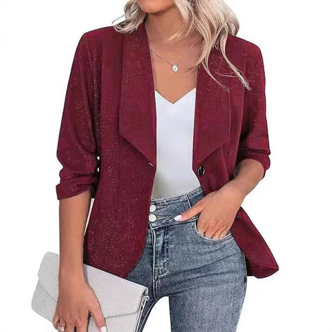 Women's slim-fitting black polyester cardigan jacket with long sleeves on a hanger.