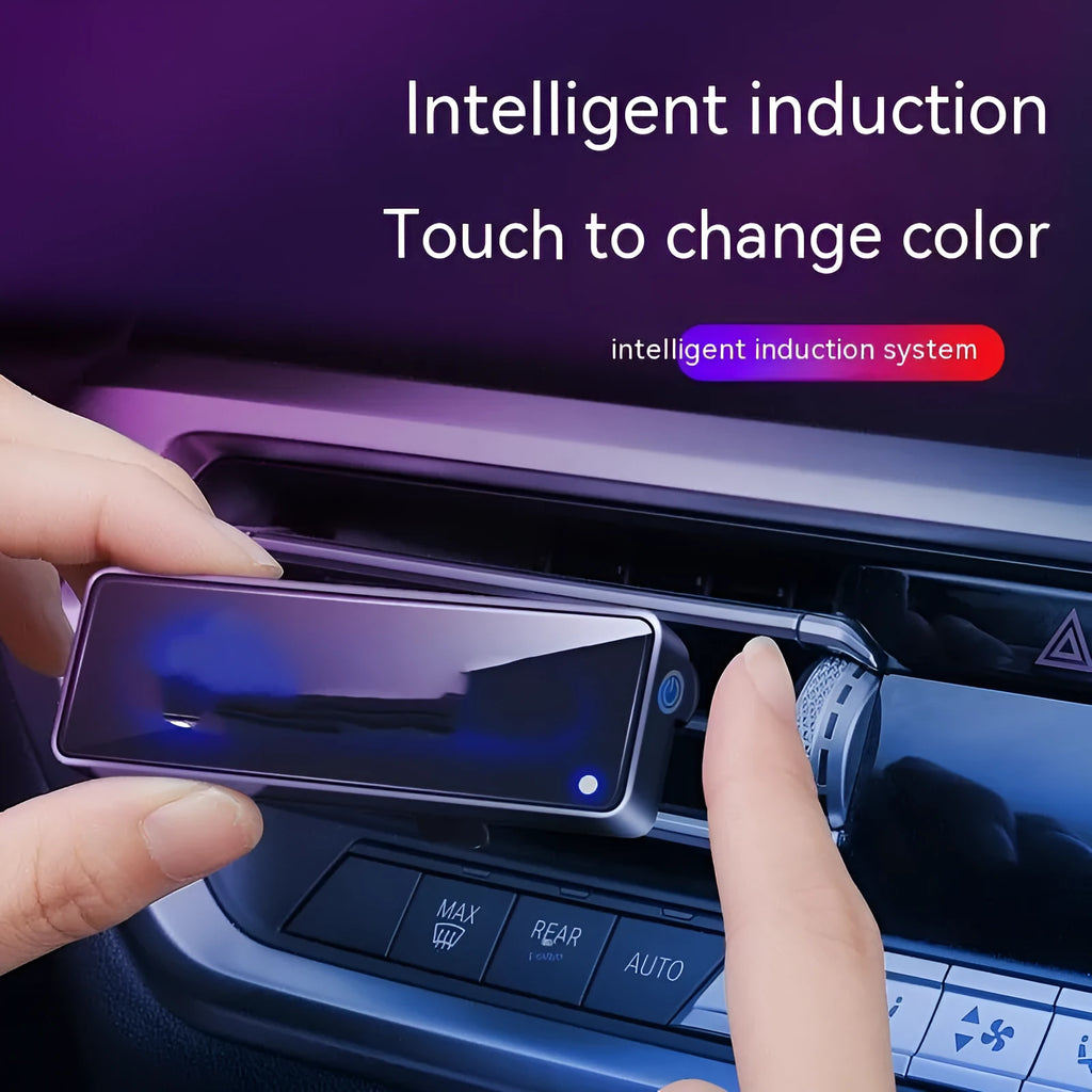 Black car air vent perfume diffuser with LED light attached to dashboard vent