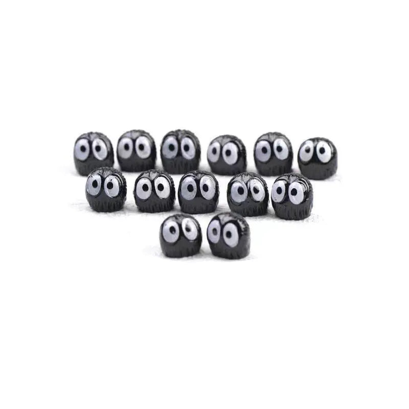 Black resin car briquette decoration with cartoon styling and traceless tape