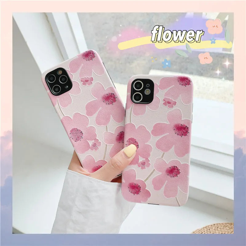 Pink soft rubber iPhone case with Japanese-Korean design showing lanyard hole