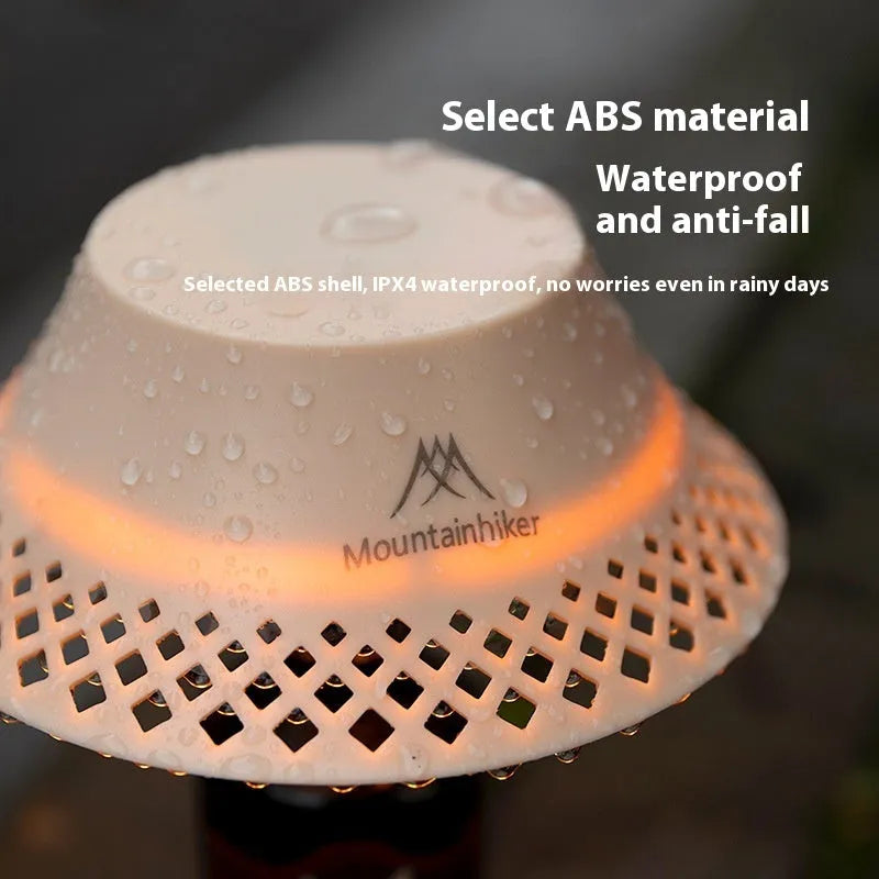 Beige and grey wine bottle shaped USB-C rechargeable camping lantern with three light modes.
