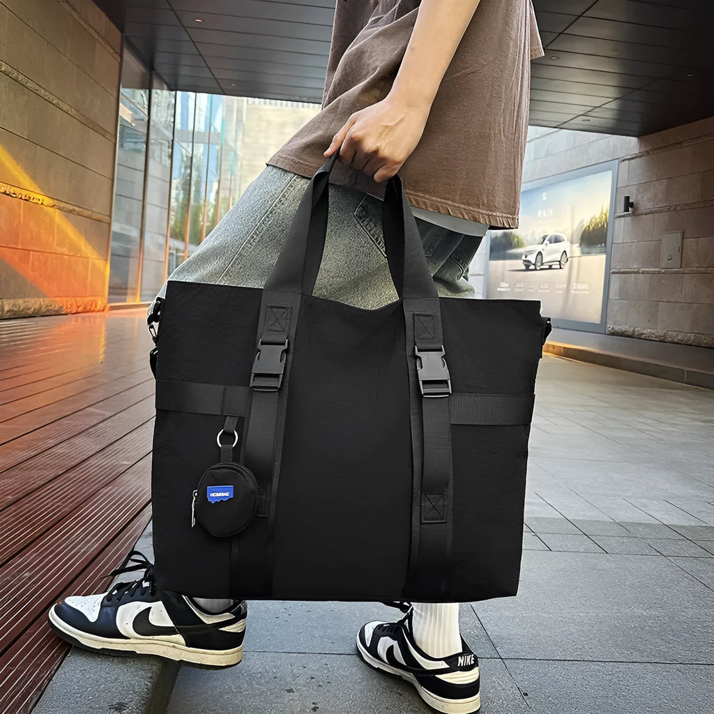 Grey Oxford cloth men's travel shoulder bag showing main compartment and detachable coin purse.