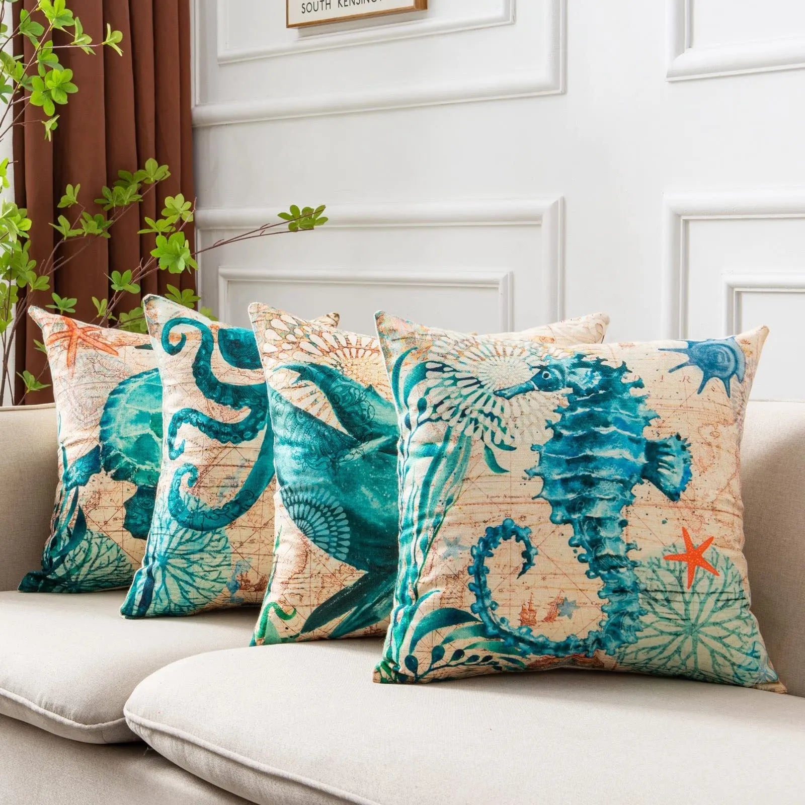 Square linen cushion cover with a detailed blue and green sea turtle print, shown on a grey sofa.