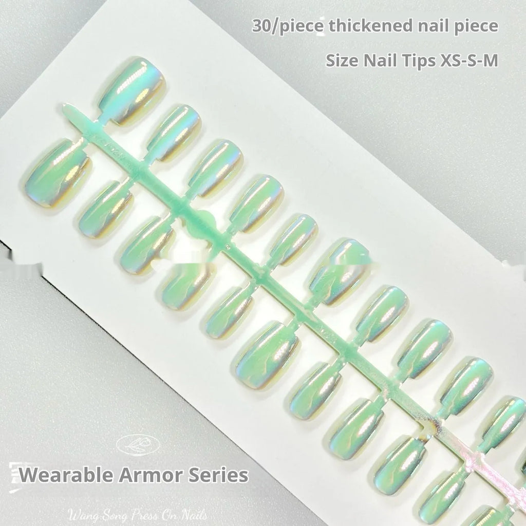 Electroplated Cat's Eye false nails in short ladder style on a hand, showing Aurora and solid colour designs.
