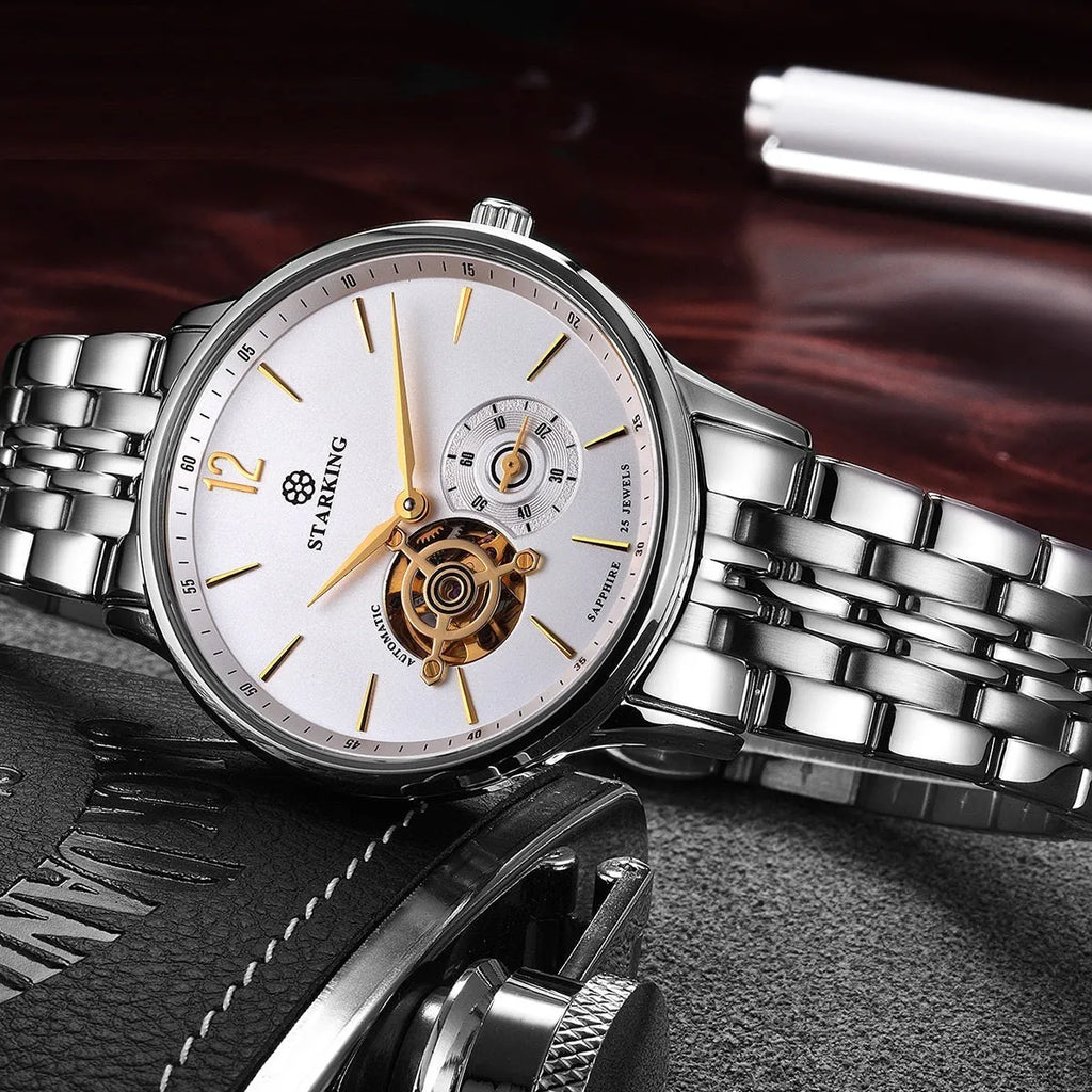 Automatic mechanical men's watch with circular dial, three hands, on steel bracelet and brown leather strap options.